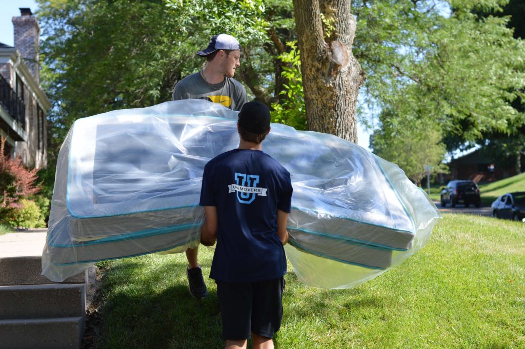 Movers moving your mattress.