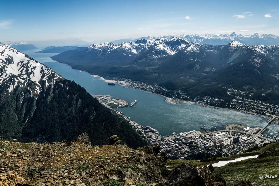 Juneau in Alaska, a state that will pay you to move there, featuring its waterways, mountains, and city.