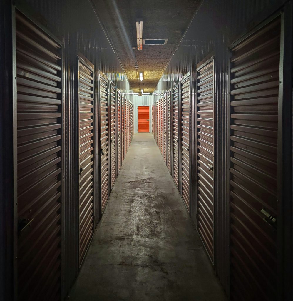 Dark hallway of indoor storage units