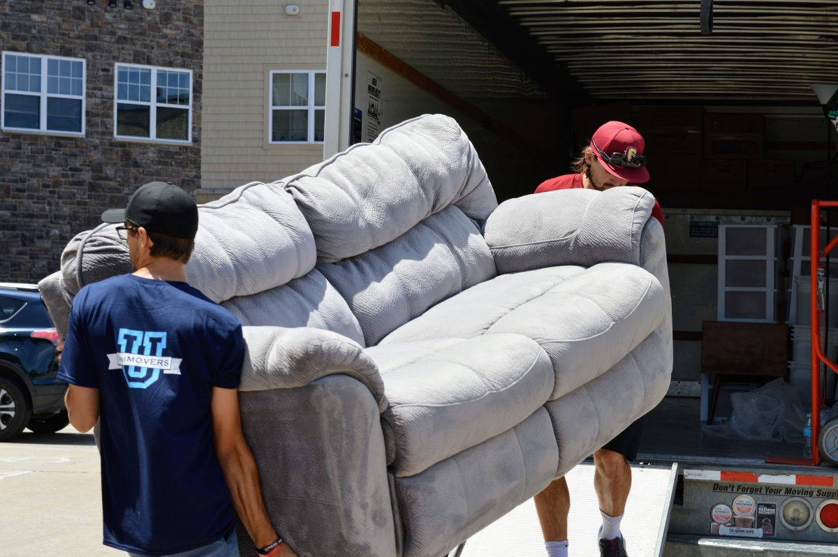Des Moines labor only movers unloading a couch