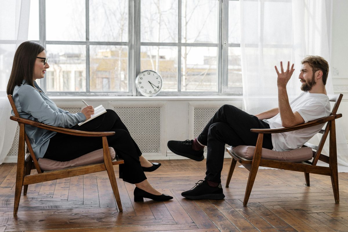 Therapist talking to patient in an office