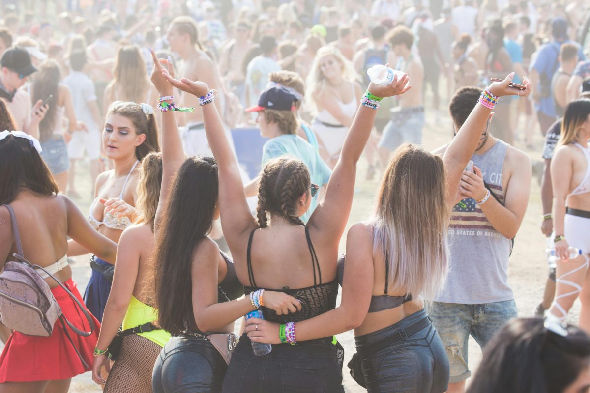 A group of people posing and celebrating at an outdoor event