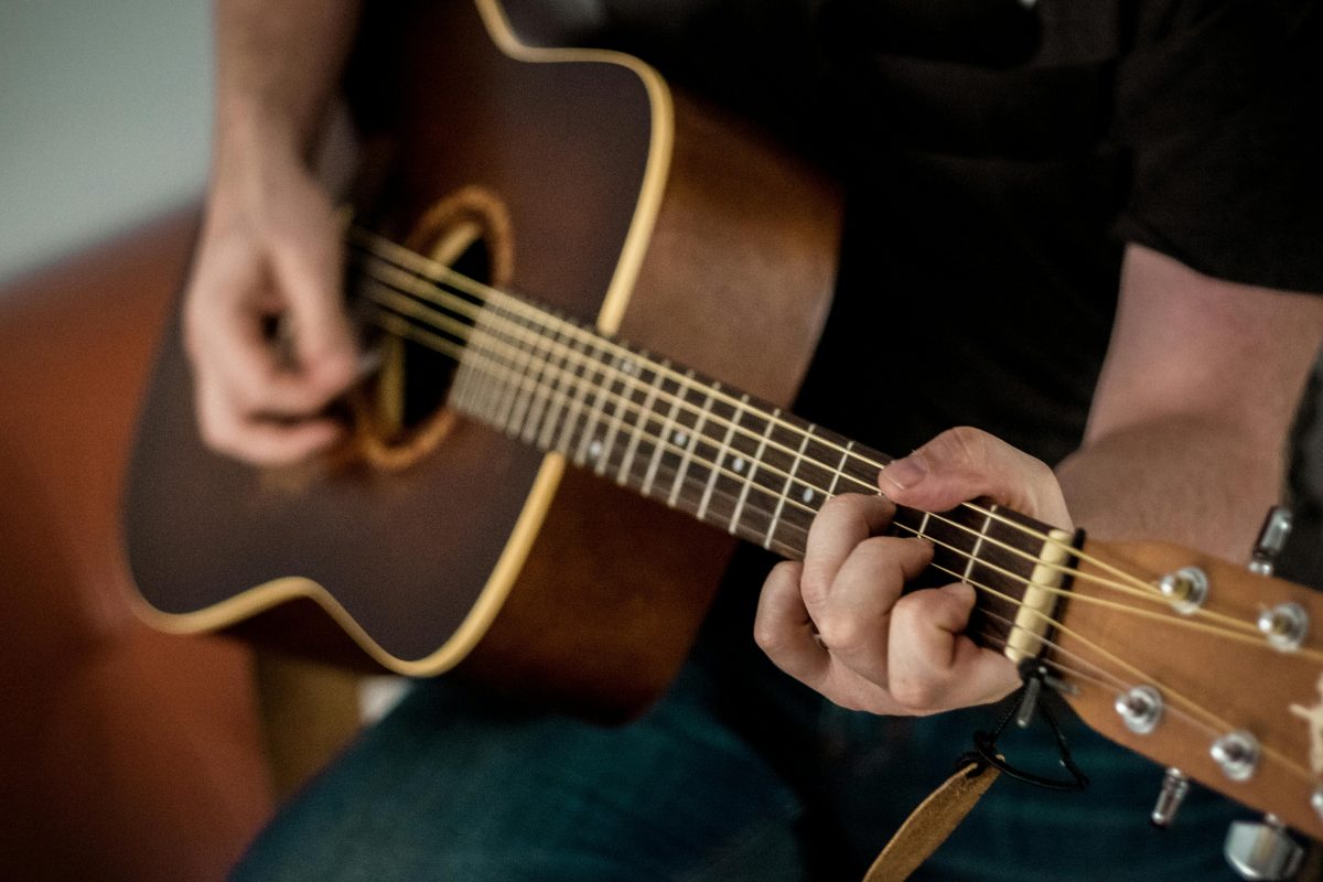 Person playing guitar