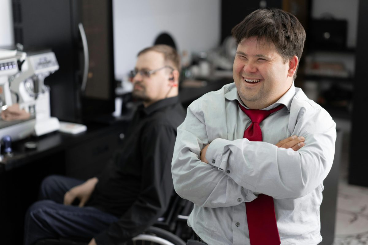 A man with Down's Syndrome smiling