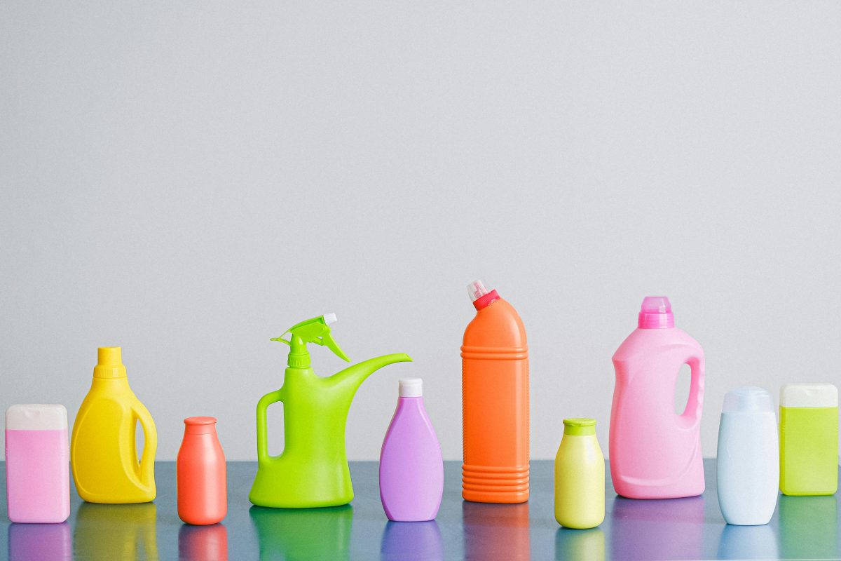 Colorful cleaning supply bottles on a table