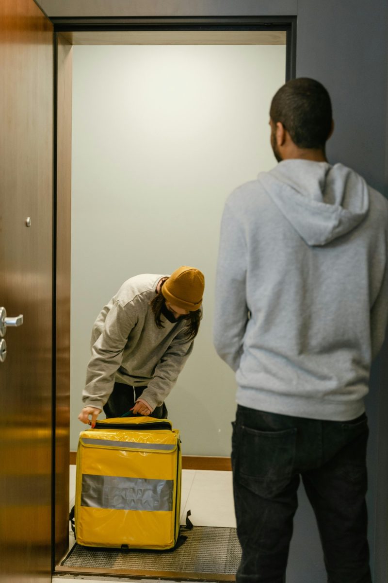 A person delivering a meal to someone else
