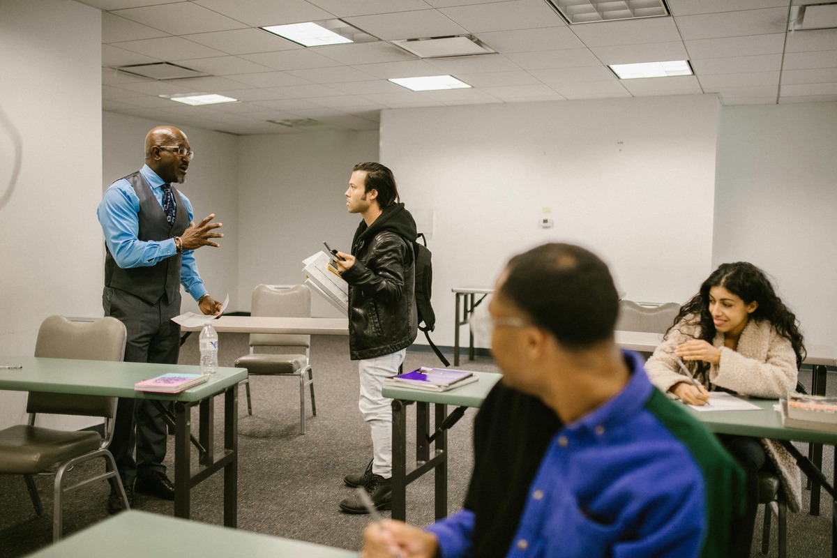 Adults in a classroom environment learning
