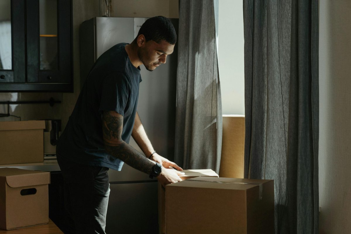 Man cleaning out a loved one's house after their death