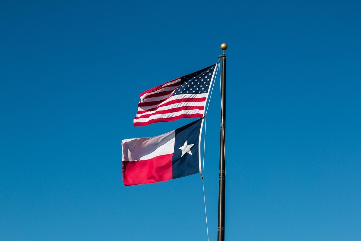 The Texas flag flying beneath the American flag