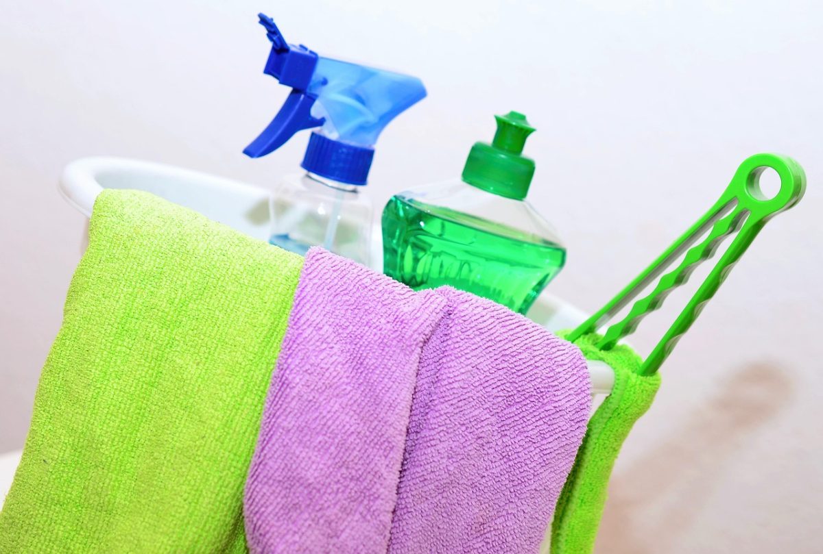 Colorful cleaning supplies and rags