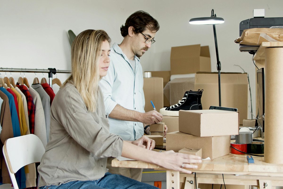 Couple busy with packing boxes