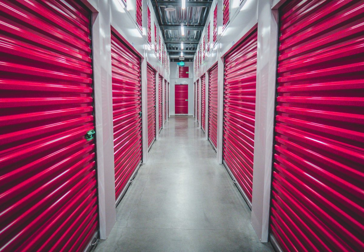 Red storage unit doors at indoor facility