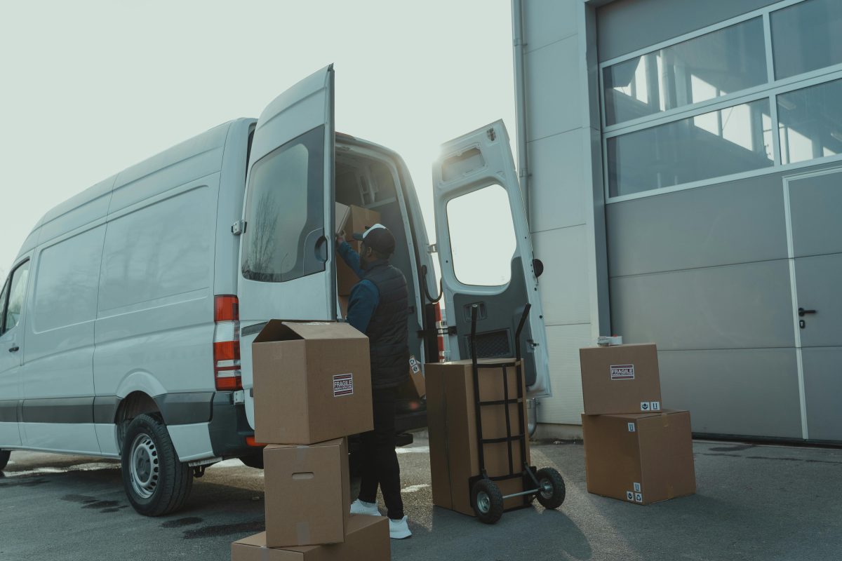 Boxes and dolly outside of a moving van