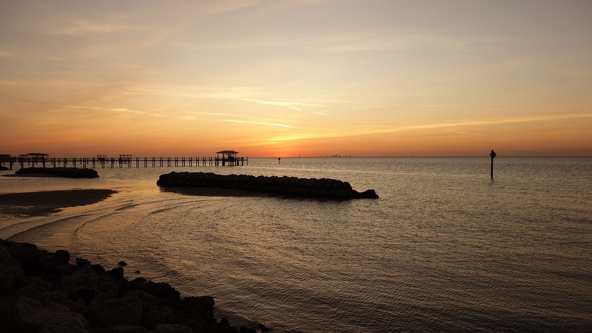 A sunset over the beach area in Tampa Bay